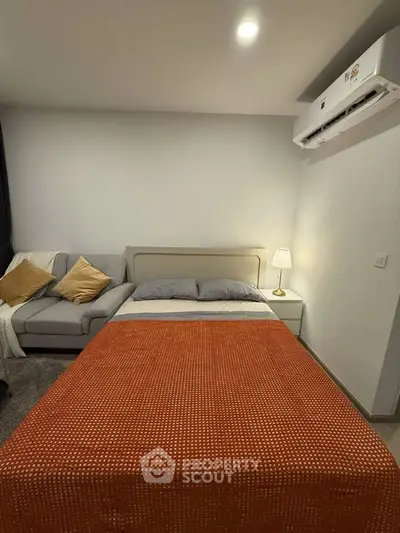 Cozy bedroom with modern decor and air conditioning