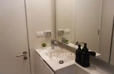 Modern bathroom with sleek sink and mirror design