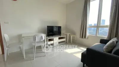 Bright living room with modern furniture and city view, perfect for urban living.