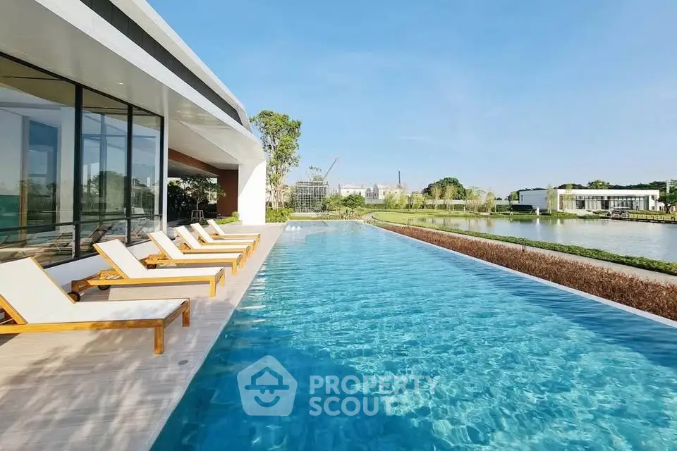 Luxurious modern villa with stunning infinity pool and serene lake view