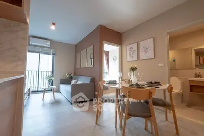 Modern open-plan living room with dining area and balcony access