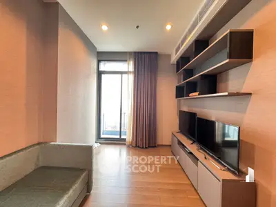 Modern living room with sleek TV unit and large window
