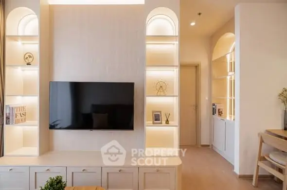 Modern living room with built-in shelves and wall-mounted TV