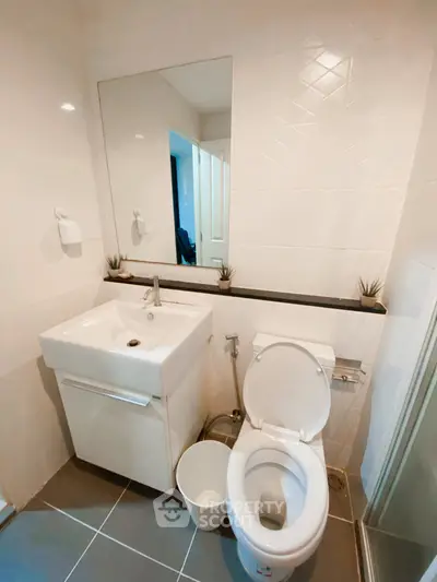 Modern bathroom with sleek fixtures and stylish design, perfect for contemporary living.