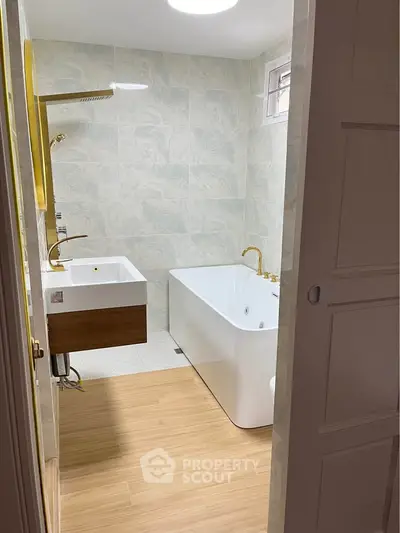 Modern bathroom with sleek bathtub and stylish fixtures