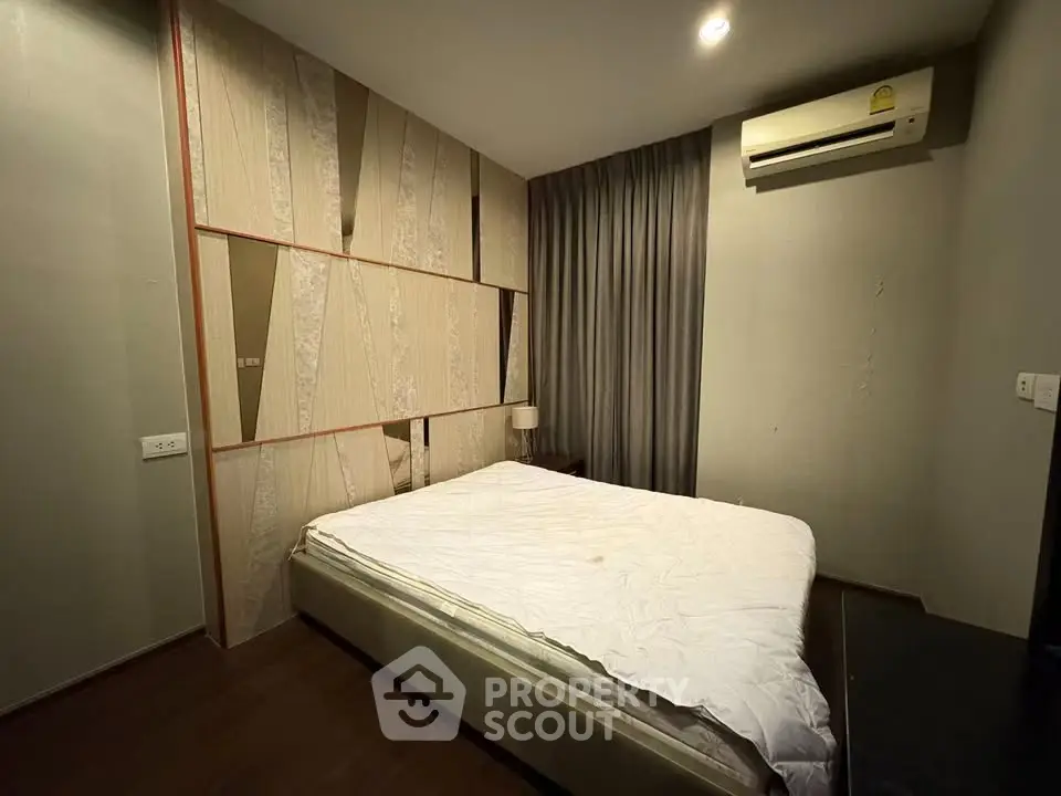 Cozy bedroom with modern decor and air conditioning unit