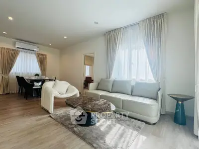 Spacious modern living room with elegant furniture and natural light