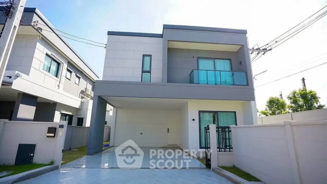 Modern two-story house with sleek design and spacious driveway