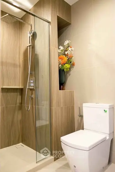 Modern bathroom with sleek shower and elegant floral decor