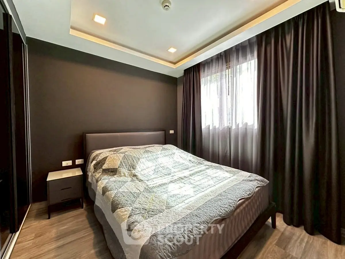 Modern bedroom with stylish decor and ample natural light