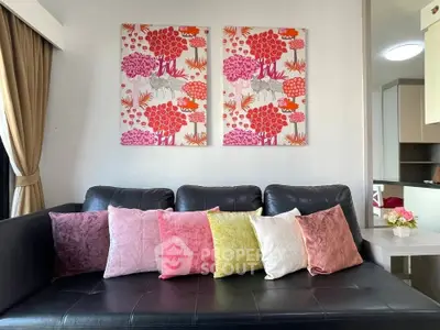 Stylish living room with colorful cushions and modern art decor