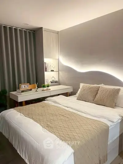 Modern bedroom with elegant lighting and stylish decor