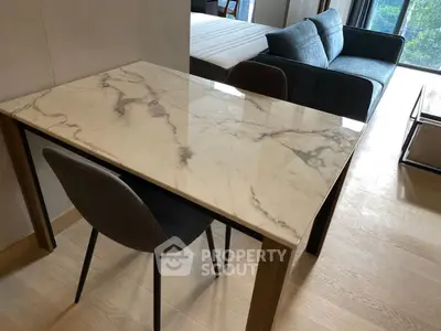 Modern apartment interior with marble table and cozy living area
