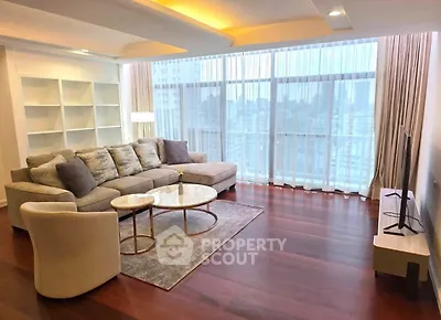 Spacious modern living room with large windows and city view