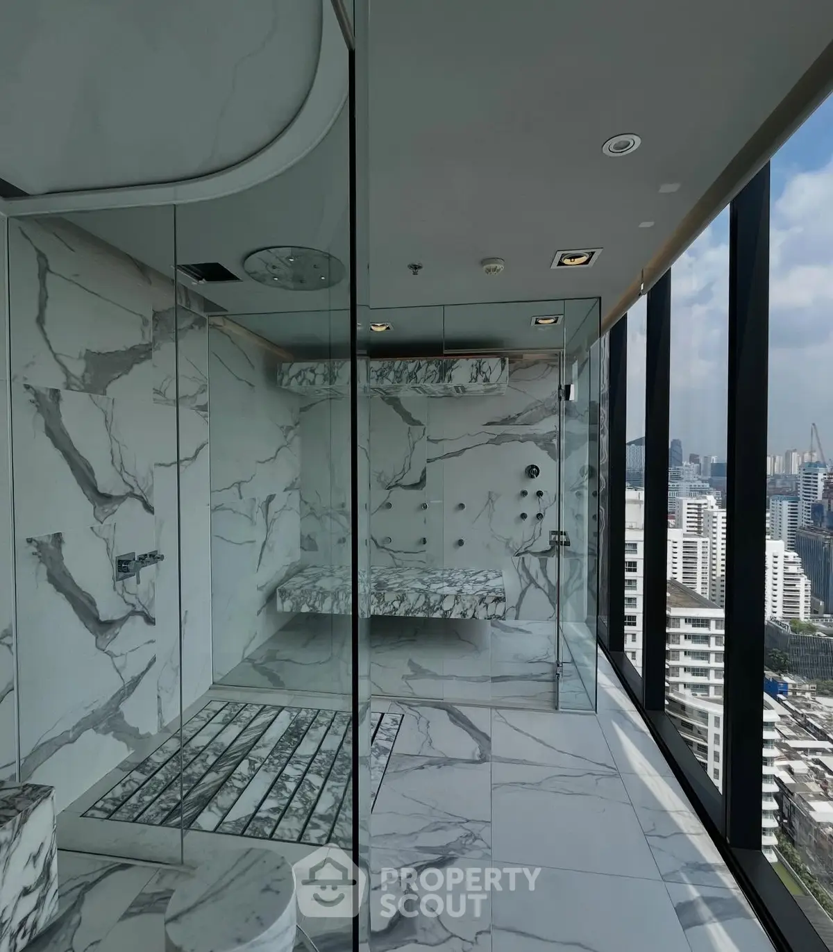 Luxurious marble bathroom with stunning city view in high-rise apartment