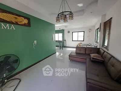Spacious living room with modern decor and natural light