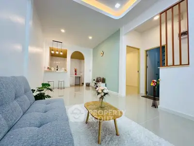 Modern living room with cozy sofa, stylish coffee table, and elegant lighting in a contemporary home.