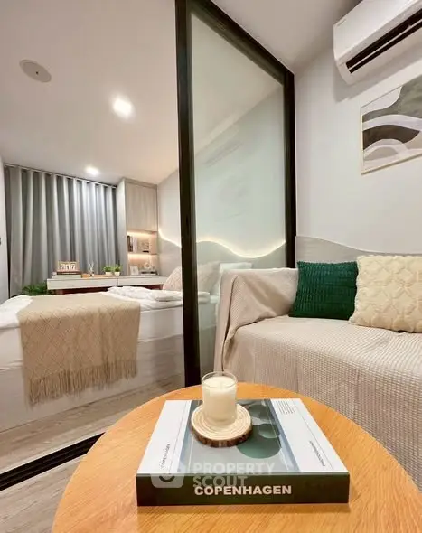 Modern studio apartment with cozy living area and stylish decor