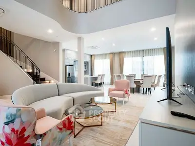Luxurious open-plan living room with elegant furniture and modern design