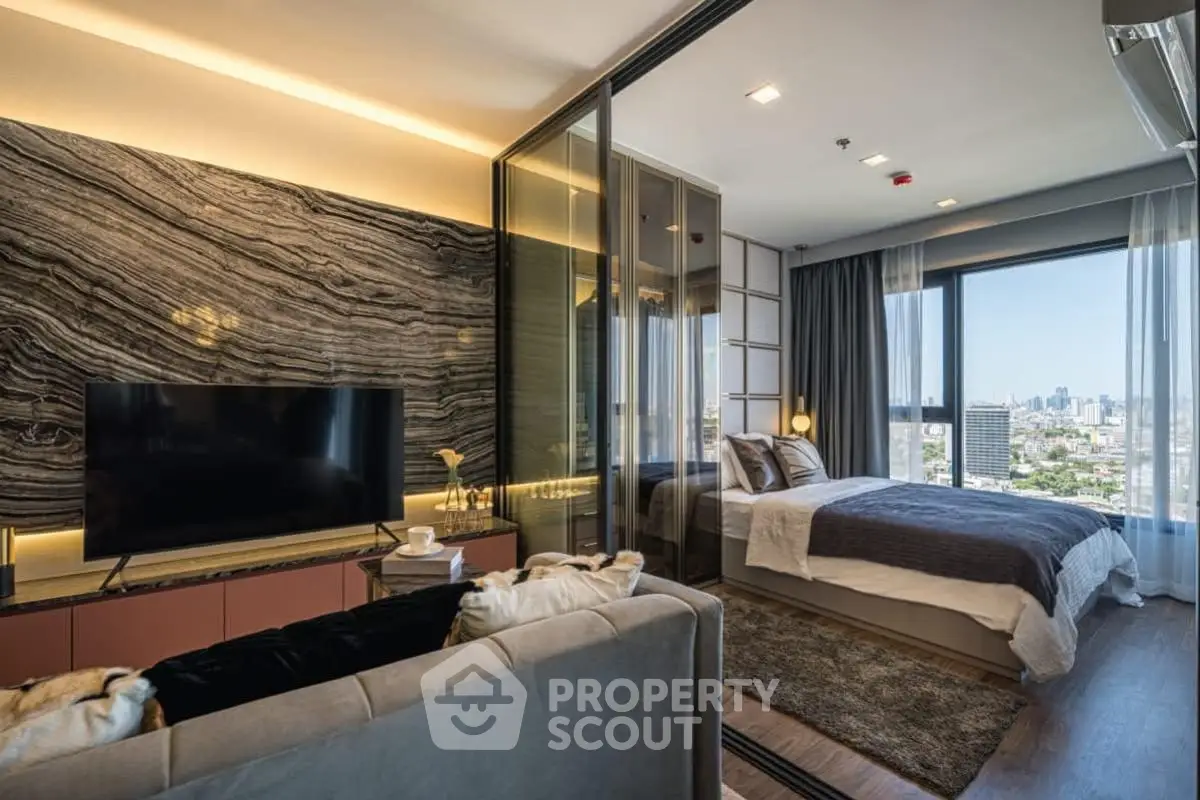 Luxurious modern apartment with open living room and bedroom, stunning city view.