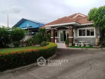 Charming suburban home with lush garden and inviting entrance, perfect for family living.