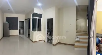 Spacious modern interior with sleek staircase and open layout