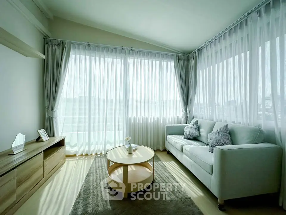 Bright and airy living room with large windows and modern decor