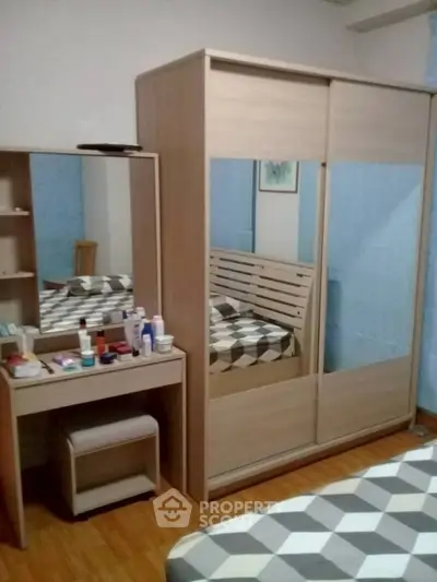 Cozy bedroom with modern wardrobe and stylish decor