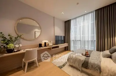 Modern bedroom with elegant decor, large window, and stylish furnishings