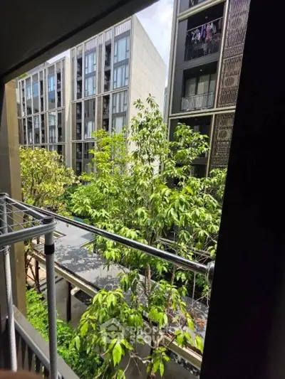 Modern apartment view with lush greenery and contemporary architecture