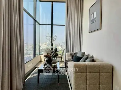 Luxurious living room with floor-to-ceiling windows and stunning city view