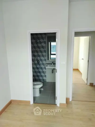 Modern apartment with stylish bathroom and wooden flooring
