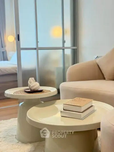 Stylish modern living room with elegant decor and cozy seating area.