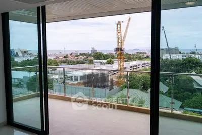 Spacious balcony with stunning city and sea view, perfect for relaxation and enjoying sunsets.