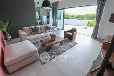 Modern living room with stylish furniture and pool view