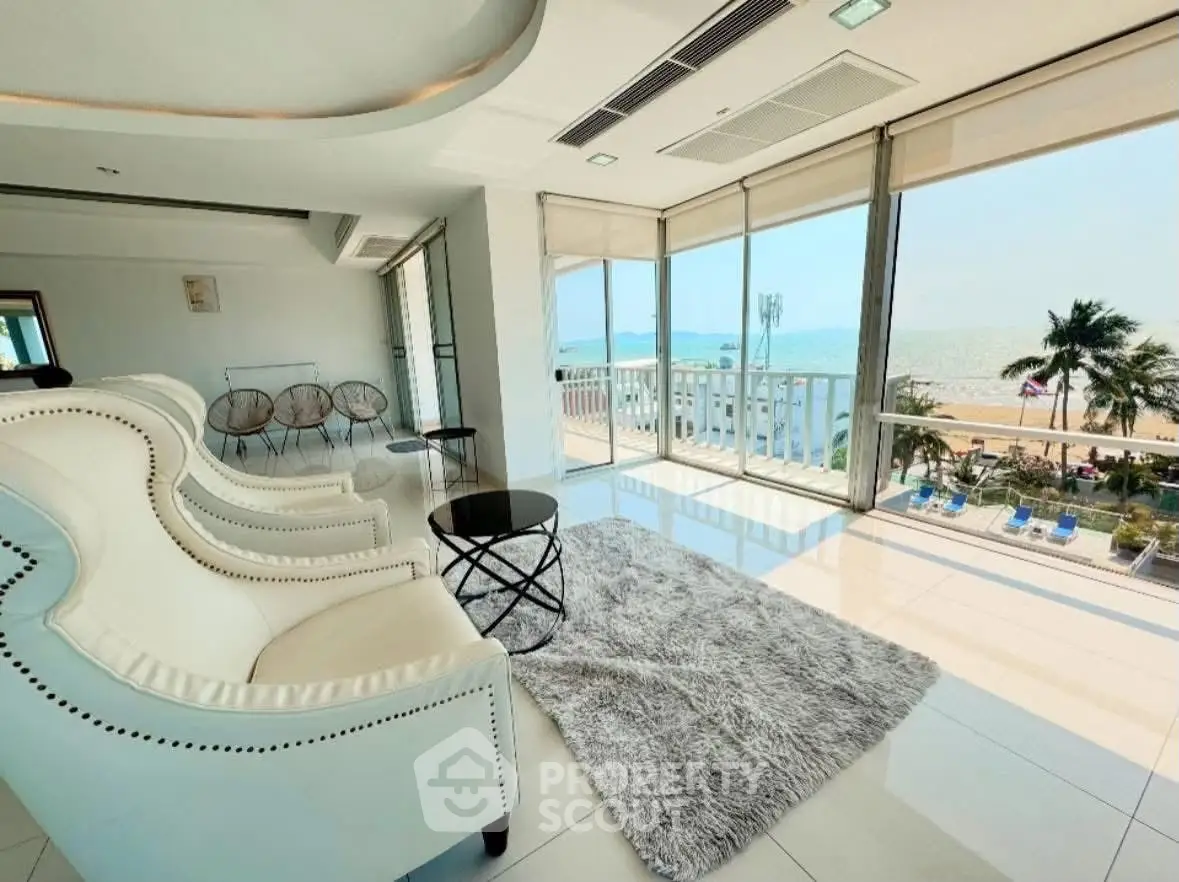 Luxurious living room with stunning ocean view and elegant seating area