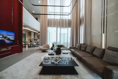 Luxurious modern living room with high ceilings and elegant decor