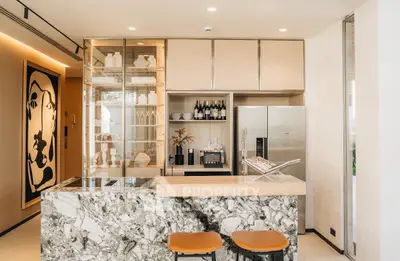 Luxurious modern kitchen with marble island and stainless steel appliances