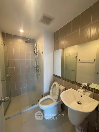 Modern bathroom with glass shower and sleek fixtures