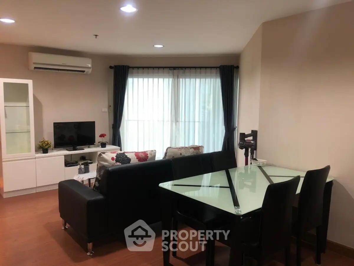Spacious living room with modern furniture and natural light