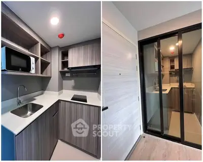 Modern compact kitchen with sleek cabinetry and built-in appliances in a stylish apartment.