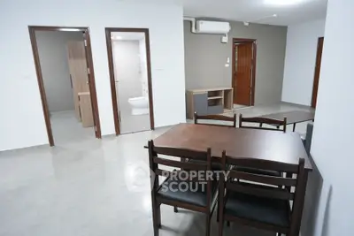 Spacious modern living area with dining table and minimalist decor