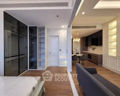 Modern open-plan living room with sleek kitchen and stylish furnishings