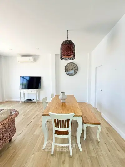 Spacious living room with elegant dining area and modern decor