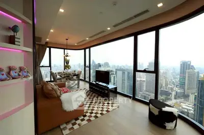 Luxurious corner unit living room with panoramic city views and modern decor