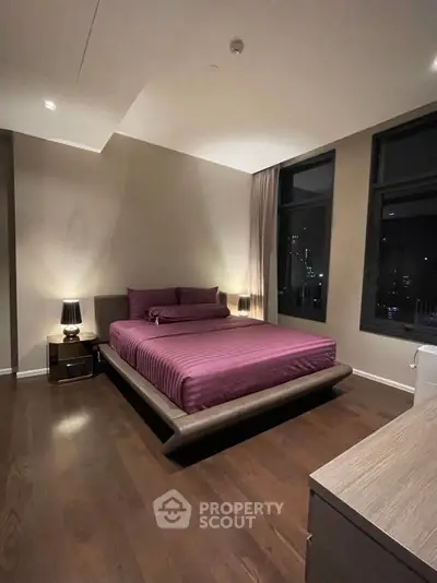 Luxurious modern bedroom with elegant lighting and city view