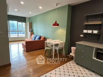 Modern living room with vibrant green walls and cozy dining area, featuring a large window with city view.
