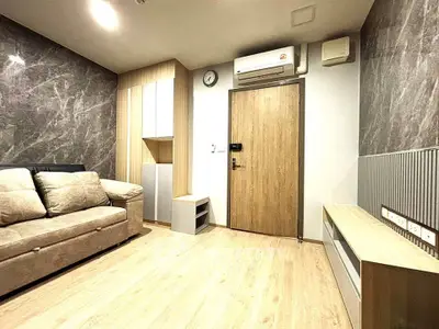 Modern living room with stylish decor and comfortable sofa in a cozy apartment.