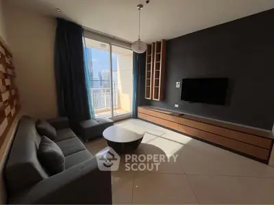 Modern living room with sleek furniture and city view balcony