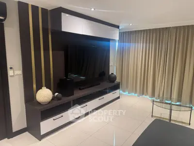 Modern living room with sleek entertainment unit and stylish decor